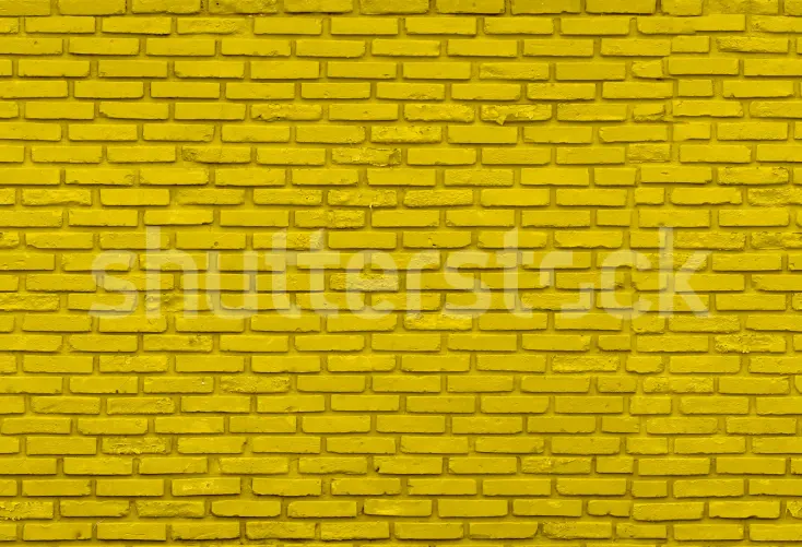 Backsteinmauer in Gelb