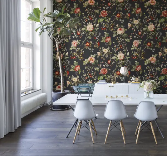 Red flowers and green leaves on dark vintage wallpaper