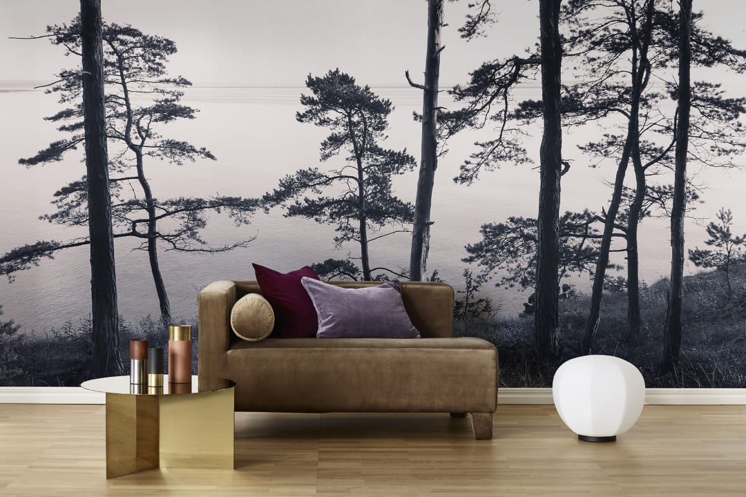 Wall mural with photo of pine trees in pink and gray hues