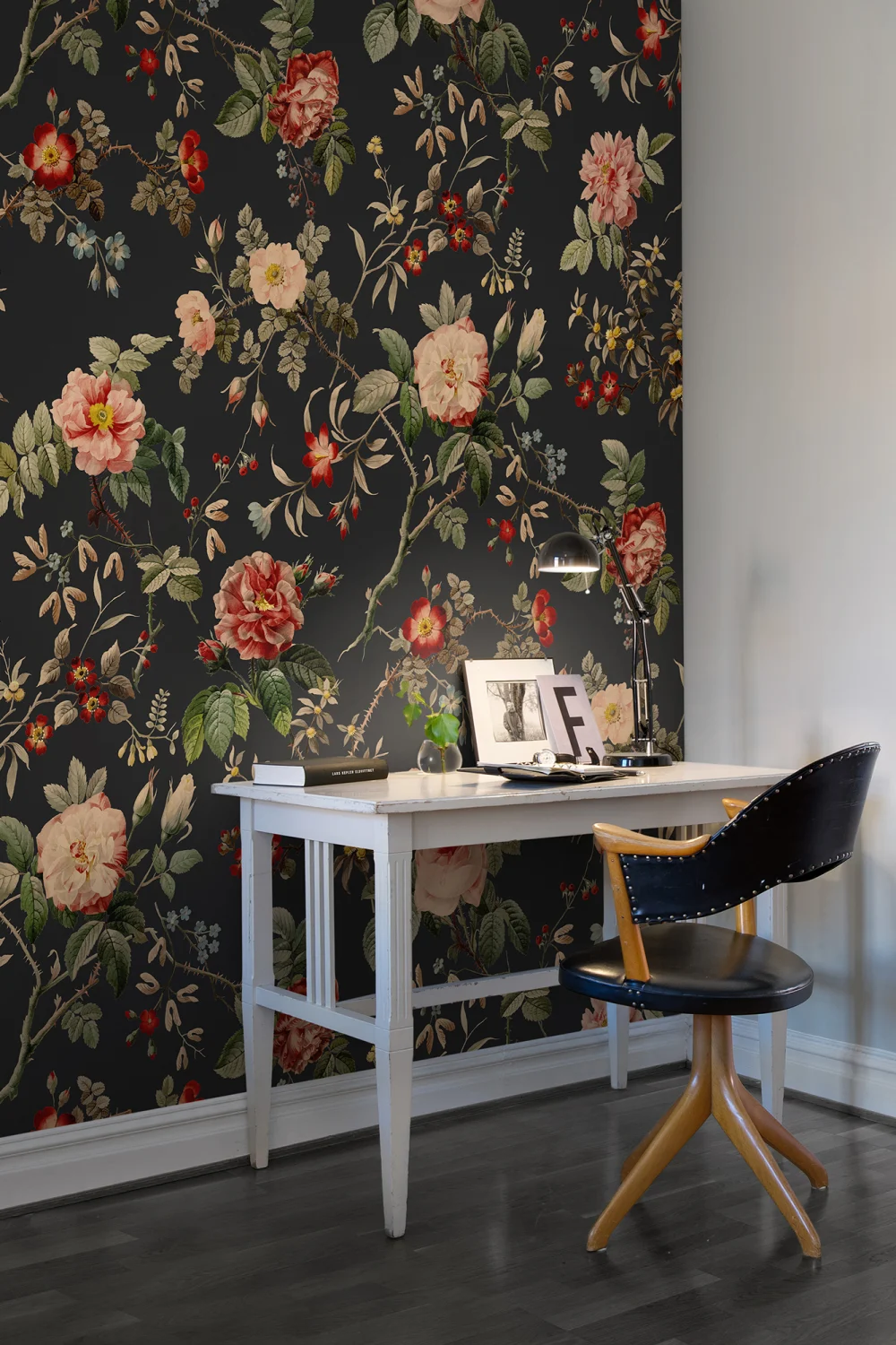 Red flowers and green leaves on dark vintage wallpaper