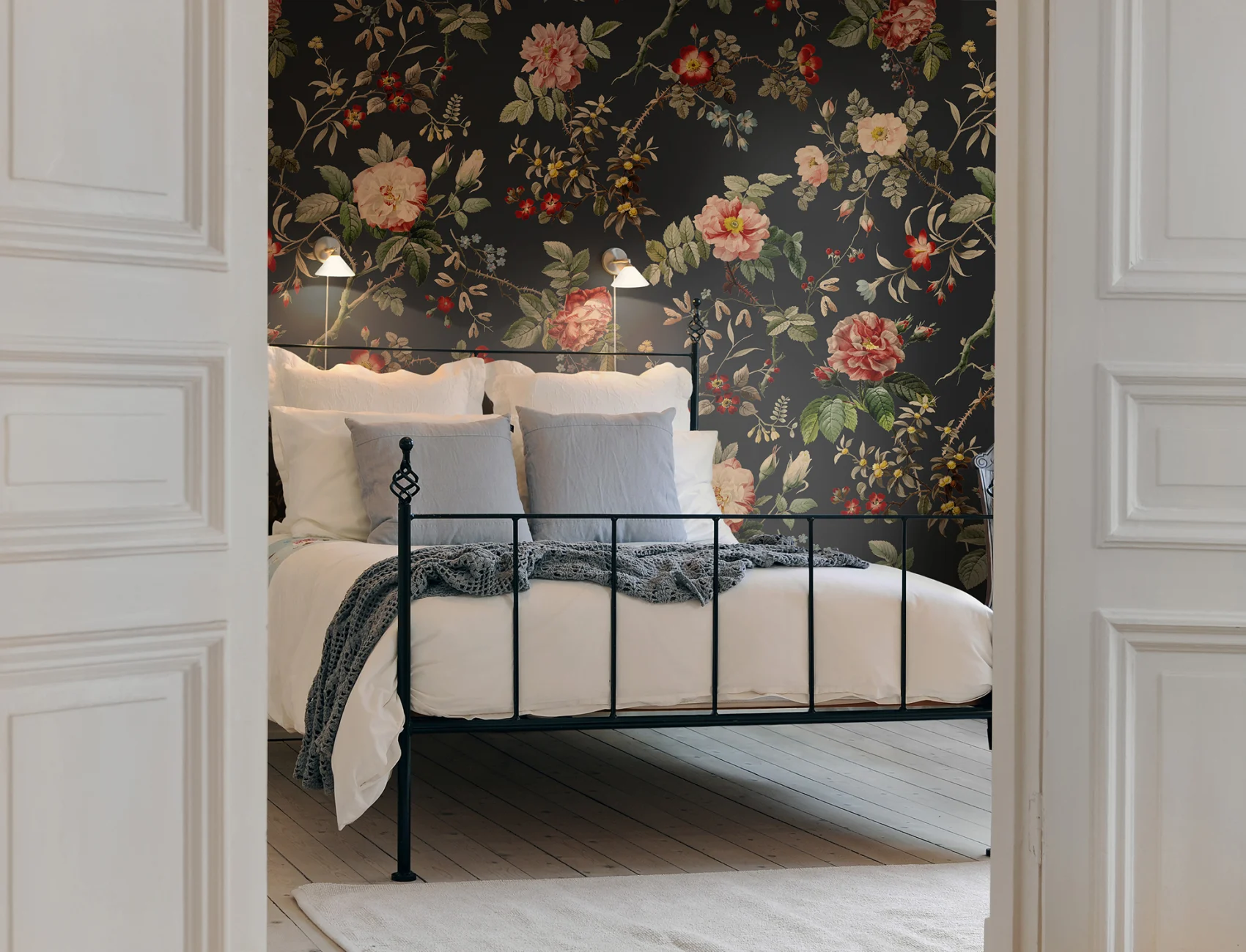 Red flowers and green leaves on dark vintage wallpaper