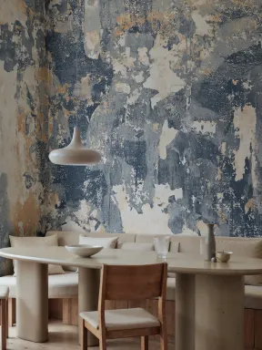 Surface wallpaper layers in a worn wall mural