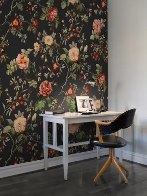 Red flowers and green leaves on dark vintage wallpaper