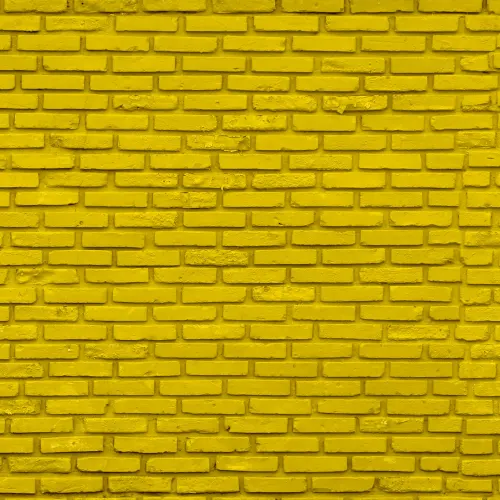 Mur i gul tegelvägg